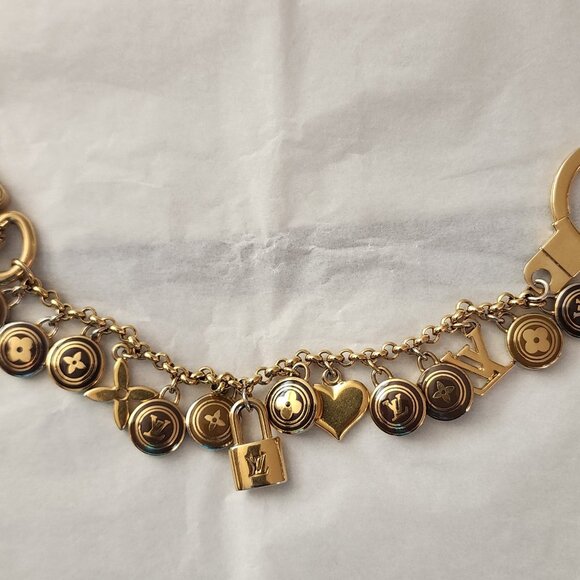 LOUIS VUITTON - AUTHENTIC, VINTAGE, AND RARE LOGO CHARM BRACELET - Picture 2 of 10